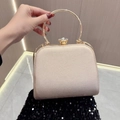 Pochette da sera champagne glitterata con manico rotondo in metallo e chiusura a diamante - Oro