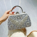 Silver rhinestone evening clutch with crystal butterfly design and metal handle - White