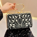 Luxury black clutch bag with pearls, rhinestones, and a gold circular handle - Black