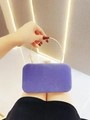 Close-up of luxury purple velvet evening bag with gold ring handle and rhinestone clasp - Blue Gray