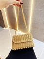 Detail of gold evening clutch bag with square yellow crystals and metal chain strap - Gold