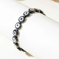 Bohemian black evil eye stretch beaded bracelet displayed on a white stand - Black (30505-bra-black)