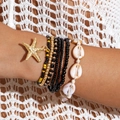 Boheems gelaagde armband met gouden zeester hanger en details van kauri-schelpen - Zwart