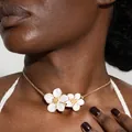 Detailed view of dual white floral acrylic shell pendants on a golden chain necklace - Gold White Double Flower Necklace (29834-1-G white)