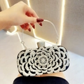 Sparkling black evening bag with silver rhinestone rose design and metal handle - Black