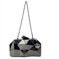 Detail of black geometric acrylic evening clutch featuring mirror finish and metal chain - Black