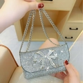 Sparkling silver rhinestone evening clutch bag with a large decorative crystal bow - Black