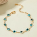 Bohemian gold beaded bracelet featuring eleven blue evil eye charms with lobster clasp - Blue Beaded Chain (30720-bra-blue-2-EP)