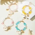Bohemian seashell beaded bracelet set with starfish charms in pink yellow and blue - Multicolor 4-Piece Set