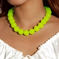 Close-up of vibrant neon yellow acrylic beaded necklace worn on a white silk blouse - Necklace / 18mm Beads / Green(27326)