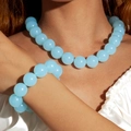 Detail of light blue beaded necklace and bracelet set with glossy finish on model - Light Blue(27326-Set)