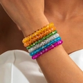 Close-up of six colorful faceted crystal-like bead bracelets worn as a stacked set - 6-Piece Set