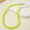 Detail of neon green acrylic beaded necklace with silver lobster clasp and extension chain - Fluorescent Green