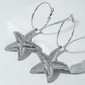 Silver-toned hoop earrings featuring large starfish pendants with paved crystals - Silver Rhinestone Starfish Hoop Earrings (29422-ear-S-6-EP)