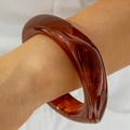 Exaggerated amber tortoiseshell resin bangle with a twisted thick statement design - Irregular Twist Amber Resin Bangle (30879)