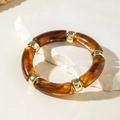 Modern chunky resin link bracelet with amber tortoise pattern and gold metal spacers - Tortoise Pattern Elastic Tubular Bangle (30879)