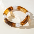 Retro acrylic resin bangle with amber tubes, white faux pearls and gold ring accents - Amber Resin Curved Tube and Artificial Pearl Bracelet (30879)