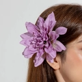 Close-up of purple 3D printed fabric flower hair clip worn on a model side hair - Purple Dahlia (28569-hp-purple)