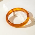 Translucent amber acrylic bangle bracelet with smooth round shape and sand-like texture - Amber Round Bar Resin Bangle (30879)