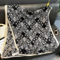 Close-up of black and white paisley print scarf with soft cotton linen texture and contrast edge - Black