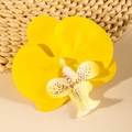 Detailed close-up of a bright yellow orchid flower clip with natural spot textures - Bright Yellow