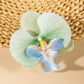 Detailed close-up of a gradient mint green orchid hair clip with a faux pearl center - Mint Green Gradient