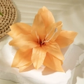 Close-up of artificial orange lily flower with detailed petals on white stone stand - Orange Yellow Lily (29622-6-yellow)