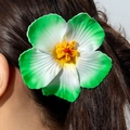 Macro shot of realistic green and white lily hair clip on model's dark hair - Green And White Gradient Hibiscus (31350-hp-gw-EP)