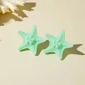 Mint green resin starfish stud earrings with realistic texture for beach vacations - Cyan