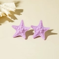 Detailed view of purple resin starfish earrings with realistic textured finish and matte surface - Purple