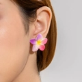 Close-up of a floral plumeria earring in purple and white gradient on a model's ear - Purple Pink Gradient