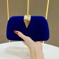 Dark blue velvet evening clutch bag featuring a gold leaf metal clasp detail - Blue