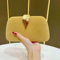 Elegant bright yellow velvet clutch bag featuring a detailed golden leaf metal clasp - Camel