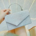 Elegante silberne Pailletten-Abendtasche mit rundem Metallgriff für formelle Feiern - Silber