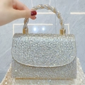 Silver rhinestone evening clutch with a unique twisted handle and square flap design - Gold