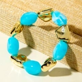 Beaded bracelet set with sky blue resin and mirror gold metal beads on linen stand - Sky Blue Resin Beads and Gold Metal Beads Bracelet (31598)