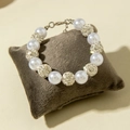 Detail of beaded bracelet with faux pearls and rhinestone charms on velvet display cushion - Rhinestone Ball Pearl Single Chain Style (31259-bra-S-EP)