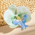 Detailed macro view of realistic faux butterfly orchid flower head with delicate fabric texture - Blue Green Mixed Style (29517-5)