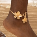 Golden double-layer anklet with brushed flower pendants and OT clasp on beach - Gold Double Layer Flower OT Clasp Anklet (29834-G)