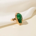 Detailed close-up of a vintage golden ring featuring a large oval green malachite stone - Irregular Ripple Ring (28985-r-green-2) / Mint Green Resin