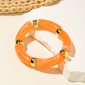 Orange resin beaded bracelet with wavy pattern and polished gold-toned metal accents - Orange-Orange Water Ripple Tubular Bangle (29808)