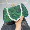 Elegant peacock blue sequin evening bag with white pearl handle and clasp detail - Green