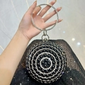 Elegant black evening bag with circular handle and sparkling rhinestone embellishments - Black