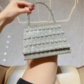 Silver evening bag with shimmering crystals and four rows of elegant white pearls - Silver