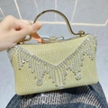 Borsa da sera color champagne con frange di strass e chiusura a fiocco di cristallo - Oro
