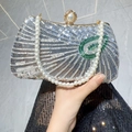 Elegant silver sequin evening clutch bag with pearl handle and green leaf detail - Silver
