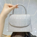 Elegant silver rhinestone clutch handbag with sparkling crystals and a curved handle - Silver