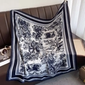 Detail of navy blue toile de jouy forest animal print square scarf on leather sofa - Navy Blue