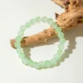 Pale green beaded bracelet made of polished glass beads on a decorative wood branch - Light Green (29960-2-green)