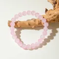 Handmade pink glass beaded bracelet hanging on a wooden branch, minimalist jewelry style - Pink (29960-3-pink)